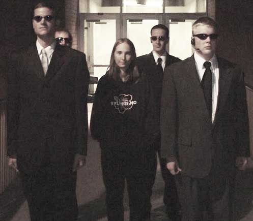 Four agent escort leaving the Hart Building
